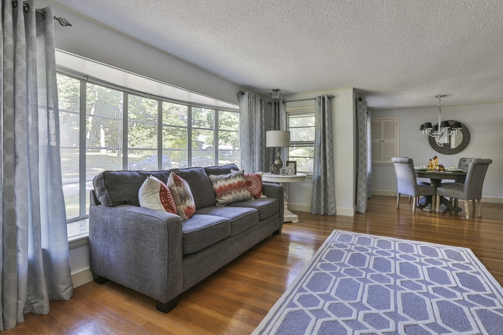 27 Gleason Road Reading, MA 01867 - Photo 3 of 28 a living room with furniture and a rug