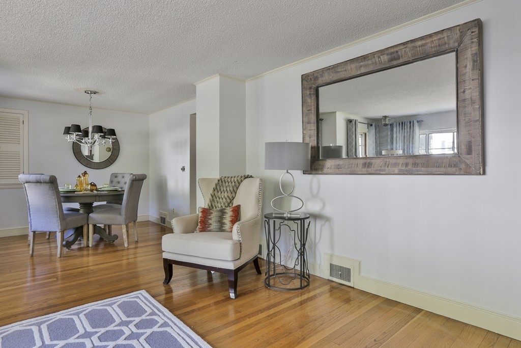 27 Gleason Road Reading, MA 01867 - Photo 8 of 28 a living room with furniture and a wooden floor