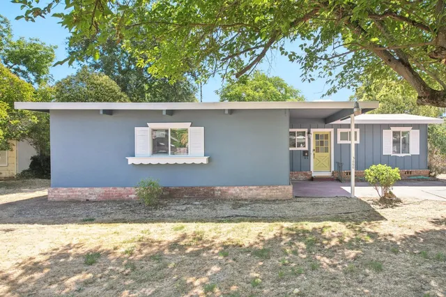 a front view of a house with a yard