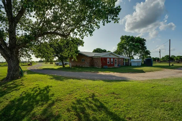 a view of a kitchen with a table and chairs