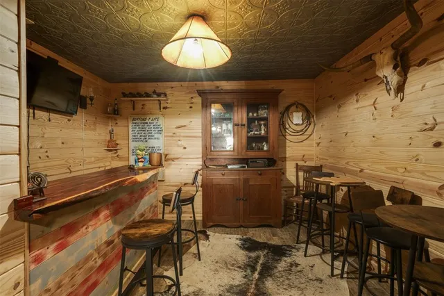 a view of a house with space porch and garden