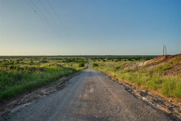a view of a lake with houses in the back