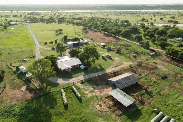 an aerial view of ocean with residential house with outdoor space