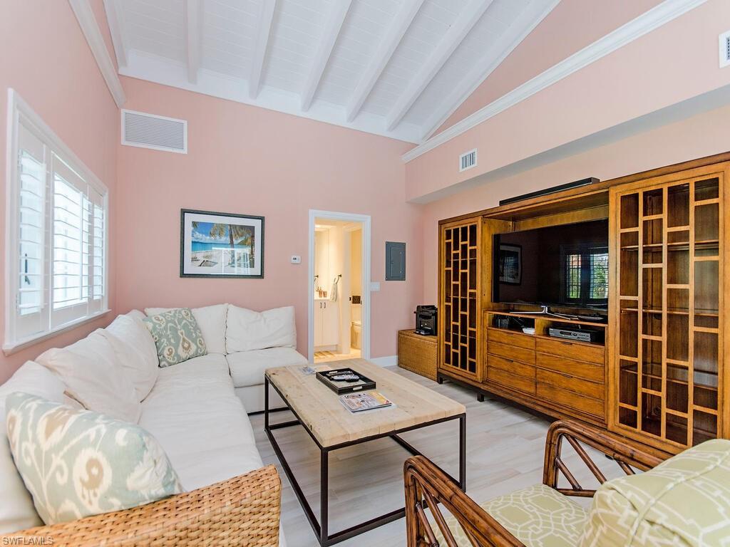 745 Pectin Road Naples, FL 34102 - Photo 17 of 18 a living room with furniture and a flat screen tv