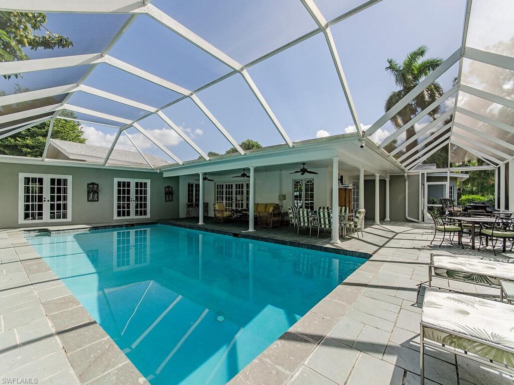 745 Pectin Road Naples, FL 34102 - Photo 3 of 18 a view of a house with a patio