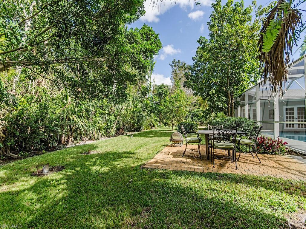 745 Pectin Road Naples, FL 34102 - Photo 4 of 18 a view of a backyard with sitting area