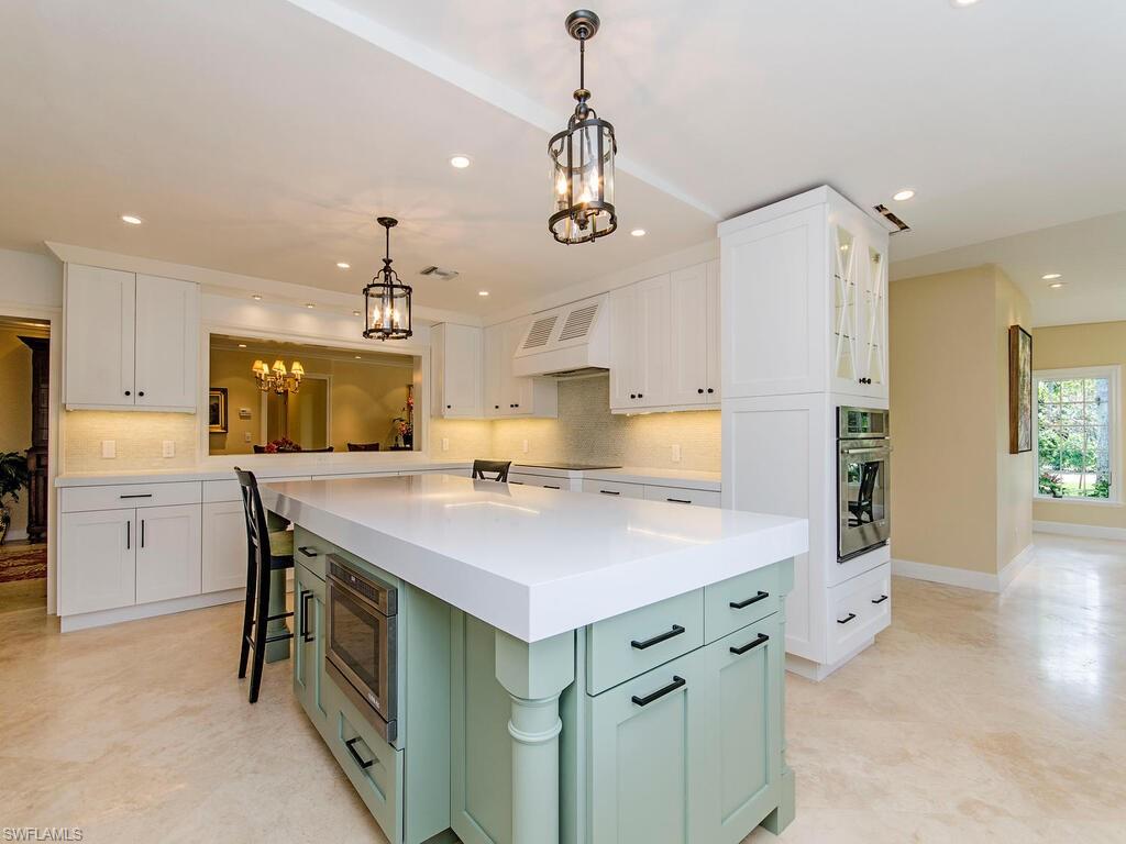 745 Pectin Road Naples, FL 34102 - Photo 9 of 18 a kitchen with a sink stove and refrigerator
