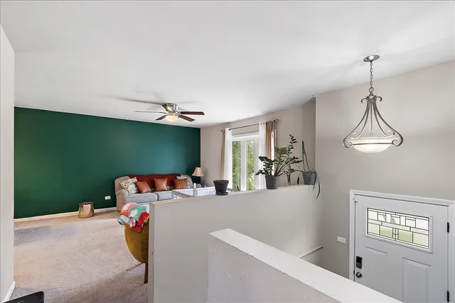 a view of a room that has a window and couch