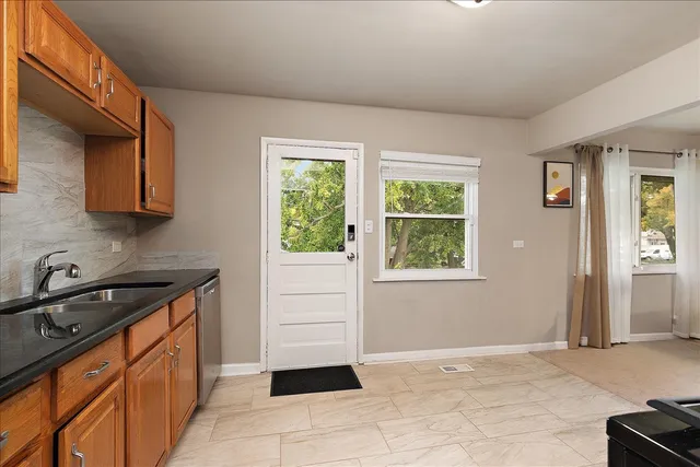 a kitchen with a sink and cabinets