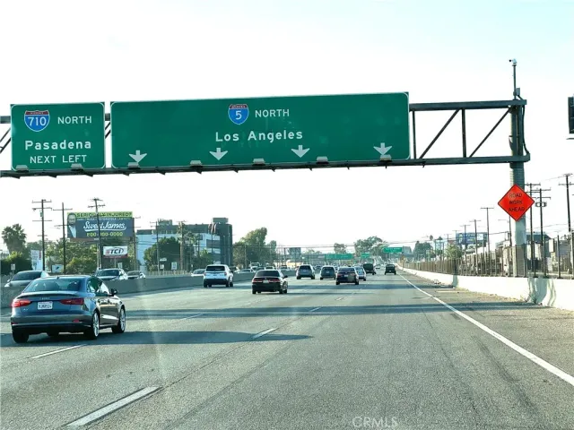 a view of a street with cars on road