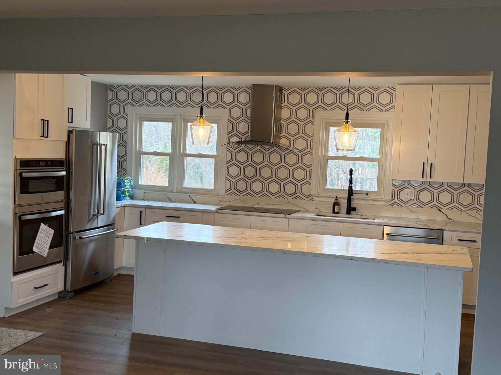 7542 Cherry Tree Drive Fulton, MD 20759 - Photo 5 of 22 a kitchen with stainless steel appliances a sink and a refrigerator