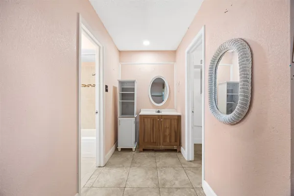 a view of a bathroom with mirror