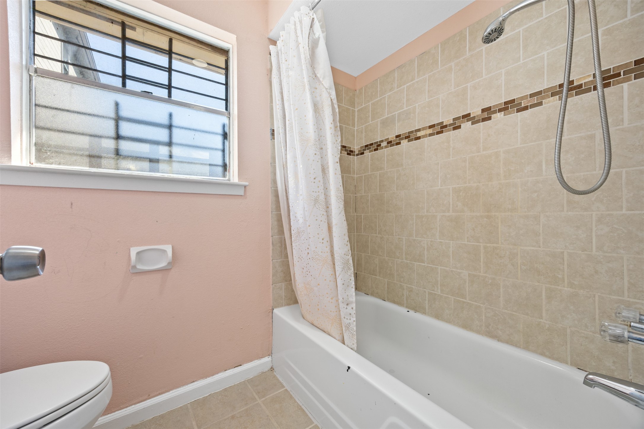 6715 Rowell Court Houston, TX 77489 - Photo 16 of 24 a bathroom with a granite countertop bathtub a window and a shower