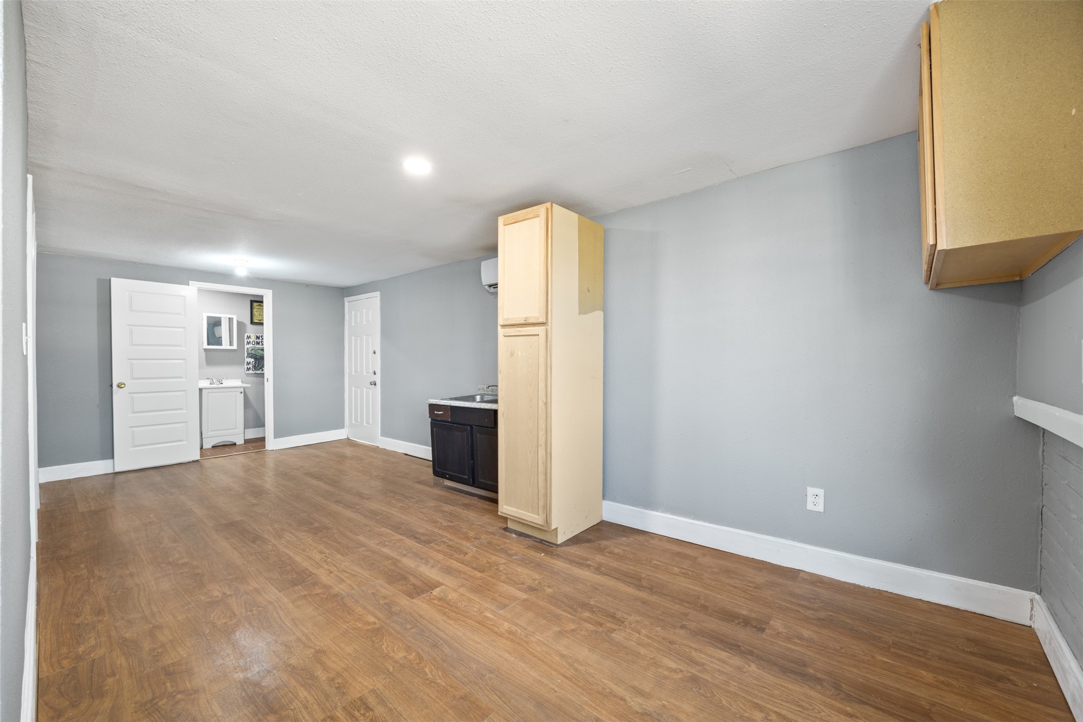6715 Rowell Court Houston, TX 77489 - Photo 18 of 24 a view of a kitchen with refrigerator and wooden floor