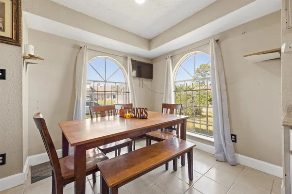 a view of a dining room with furniture window and outside view