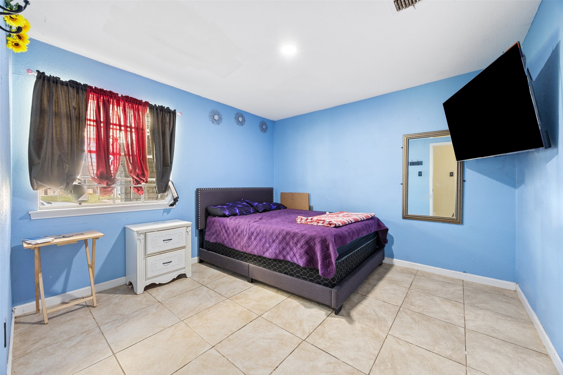 6715 Rowell Court Houston, TX 77489 - Photo 9 of 24 a spacious bedroom with a bed and window