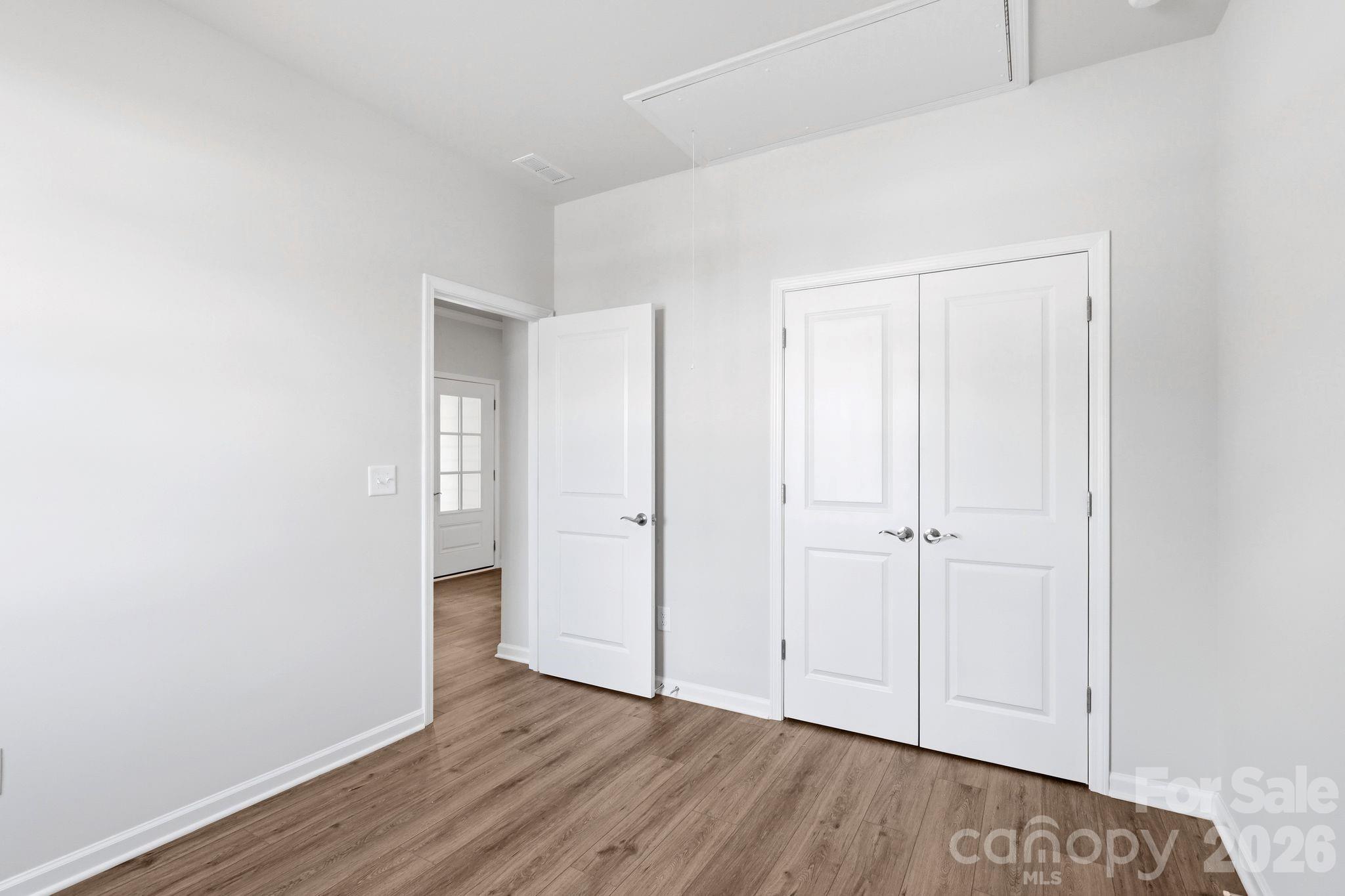 5475 Redbud Road, Unit 57 Lancaster, SC 29720 - Photo 22 of 30 a view of an empty room and wooden floor
