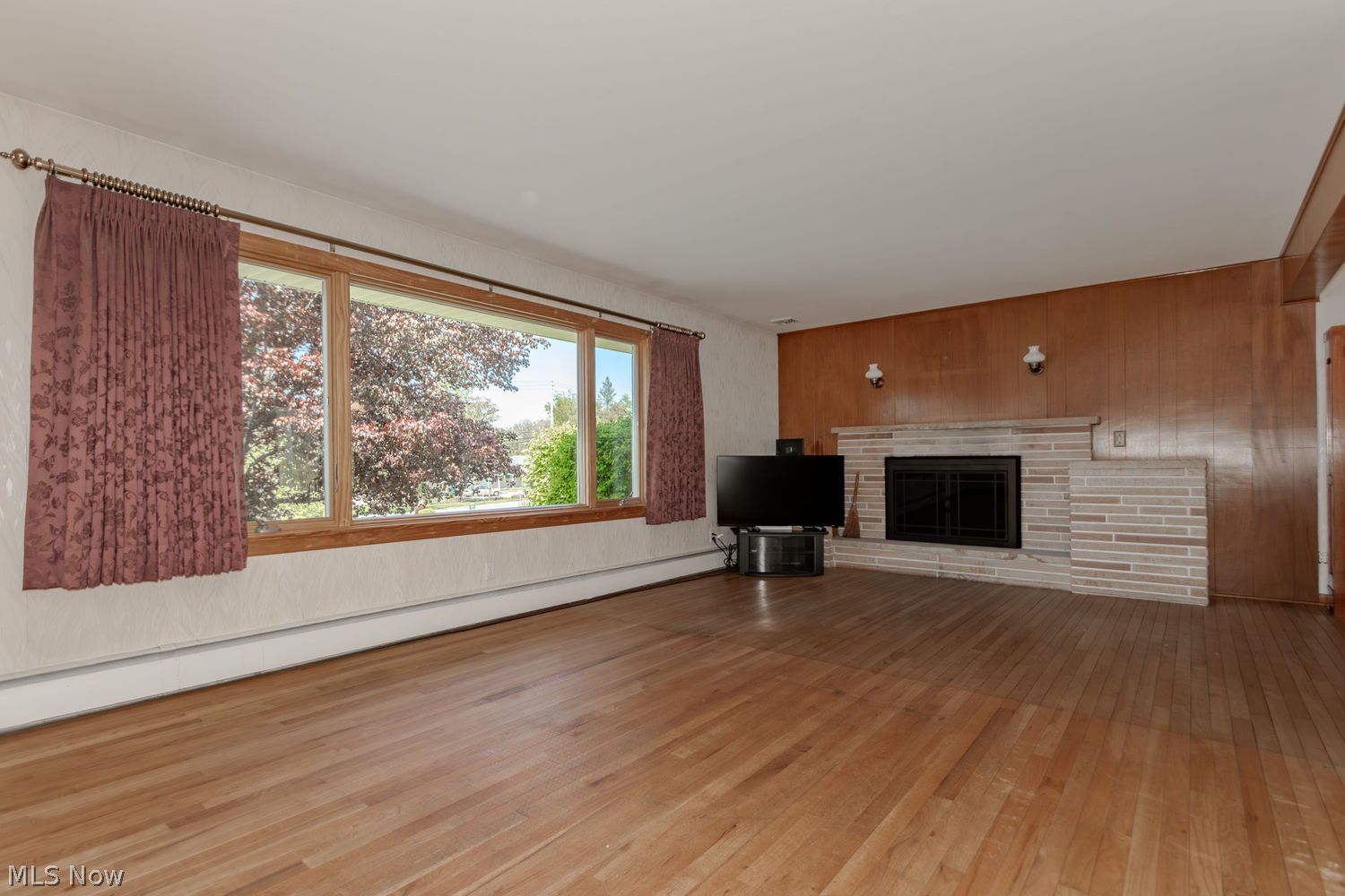 11560 Girdled Road Painesville, OH 44077 - Photo 3 of 24 Hardwood floors and wood burning fireplace is welcoming
