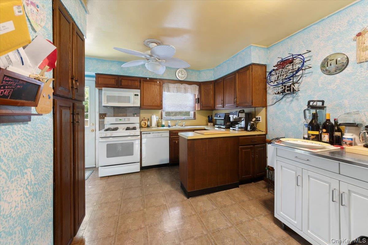 101 Cresthill Road Yonkers, NY 10710 - Photo 11 of 31 a kitchen with granite countertop a sink cabinets and stainless steel appliances