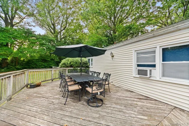 a view of deck with furniture and barbeque oven