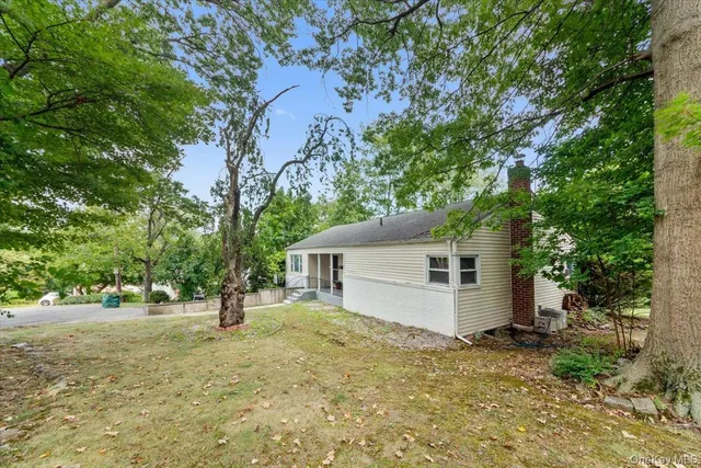 a view of a house with a tree