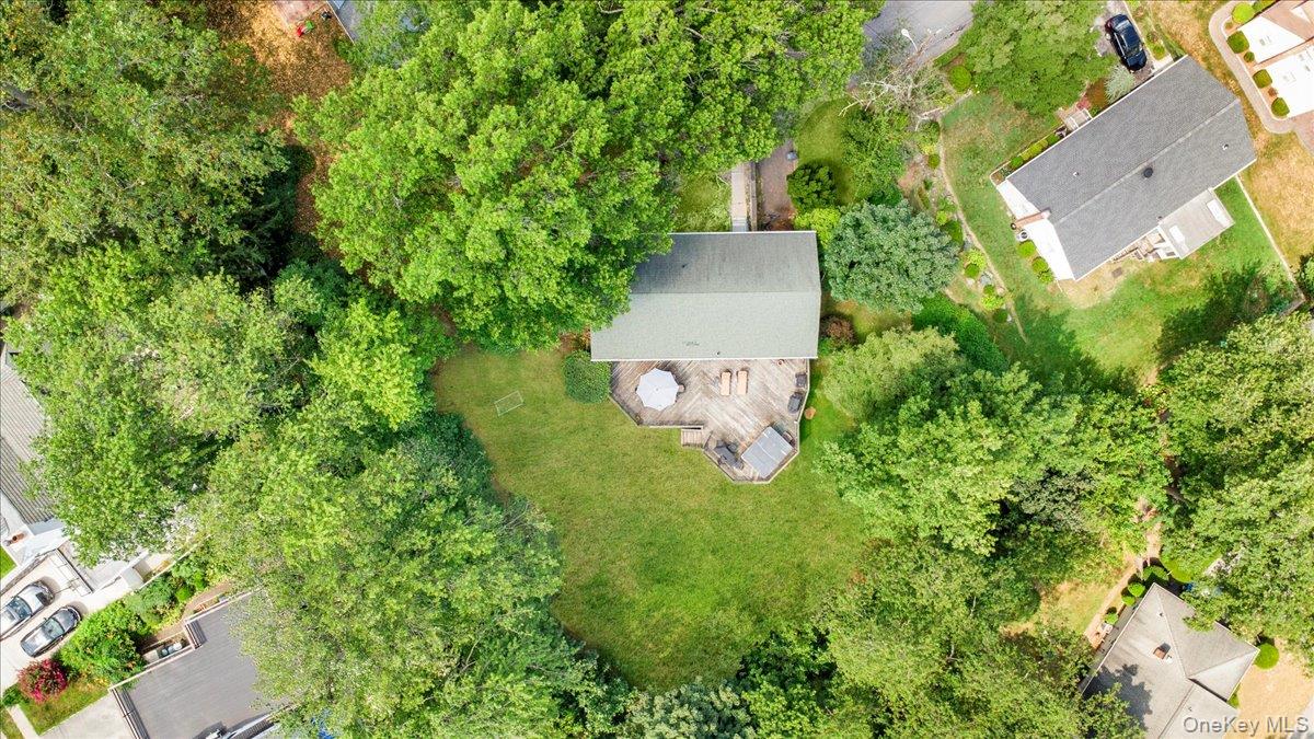 101 Cresthill Road Yonkers, NY 10710 - Photo 28 of 31 an aerial view of a house with a yard and trees all around