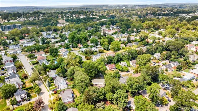 an aerial view of a houses with a lake view