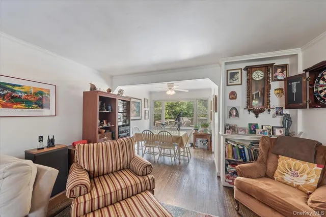 a living room with furniture or couch and a floor to ceiling window