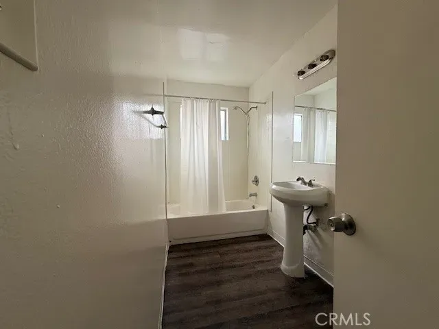 a bathroom with a sink and mirror