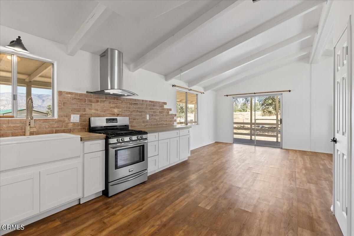 40069 Matthew Road Caliente, CA 93518 - Photo 3 of 31 a kitchen with granite countertop a stove and a sink