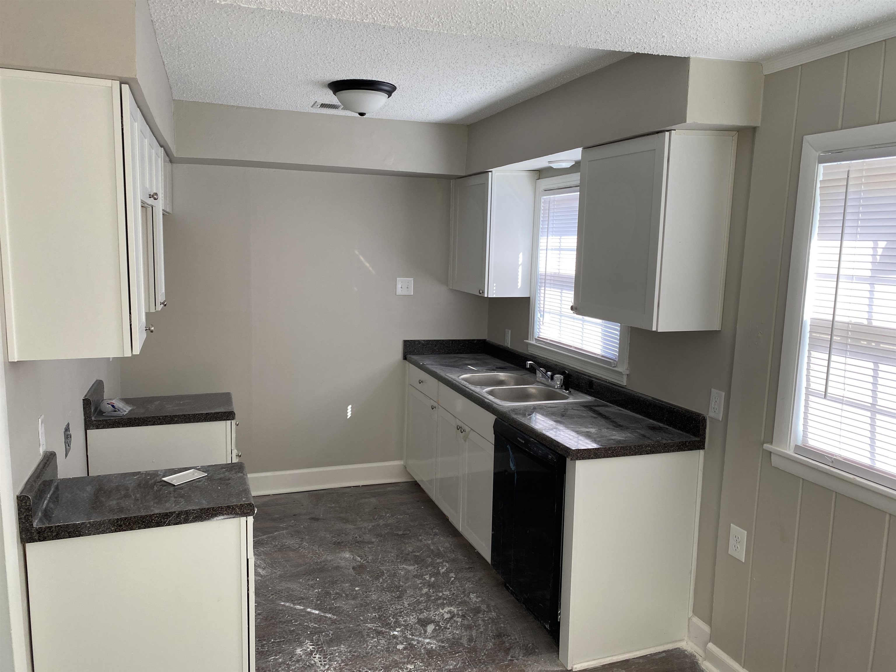 4679 Lynn Road Memphis, TN 38122 - Photo 3 of 8 a kitchen with granite countertop a sink and a stove