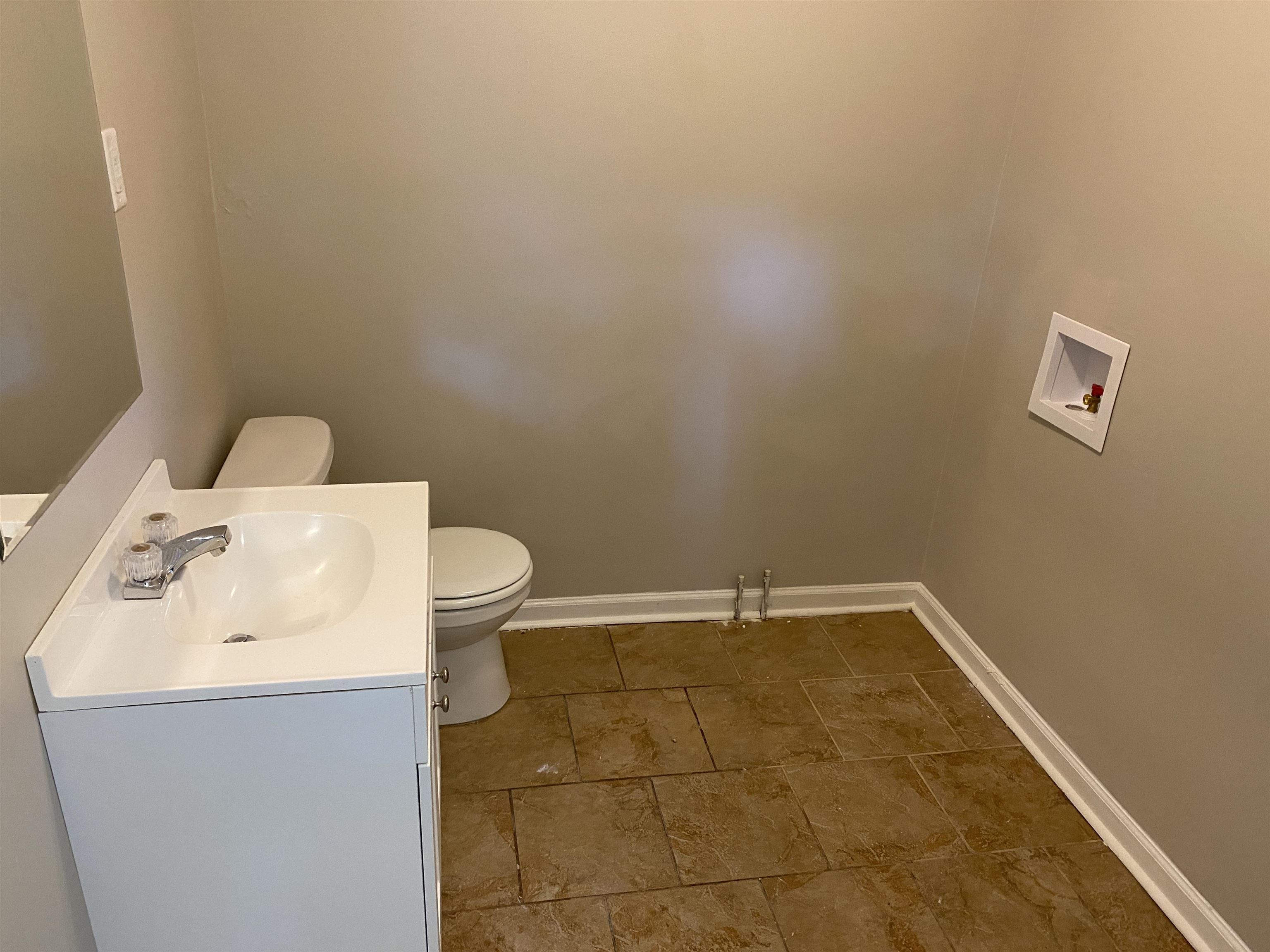 4679 Lynn Road Memphis, TN 38122 - Photo 5 of 8 a bathroom with a sink and a toilet