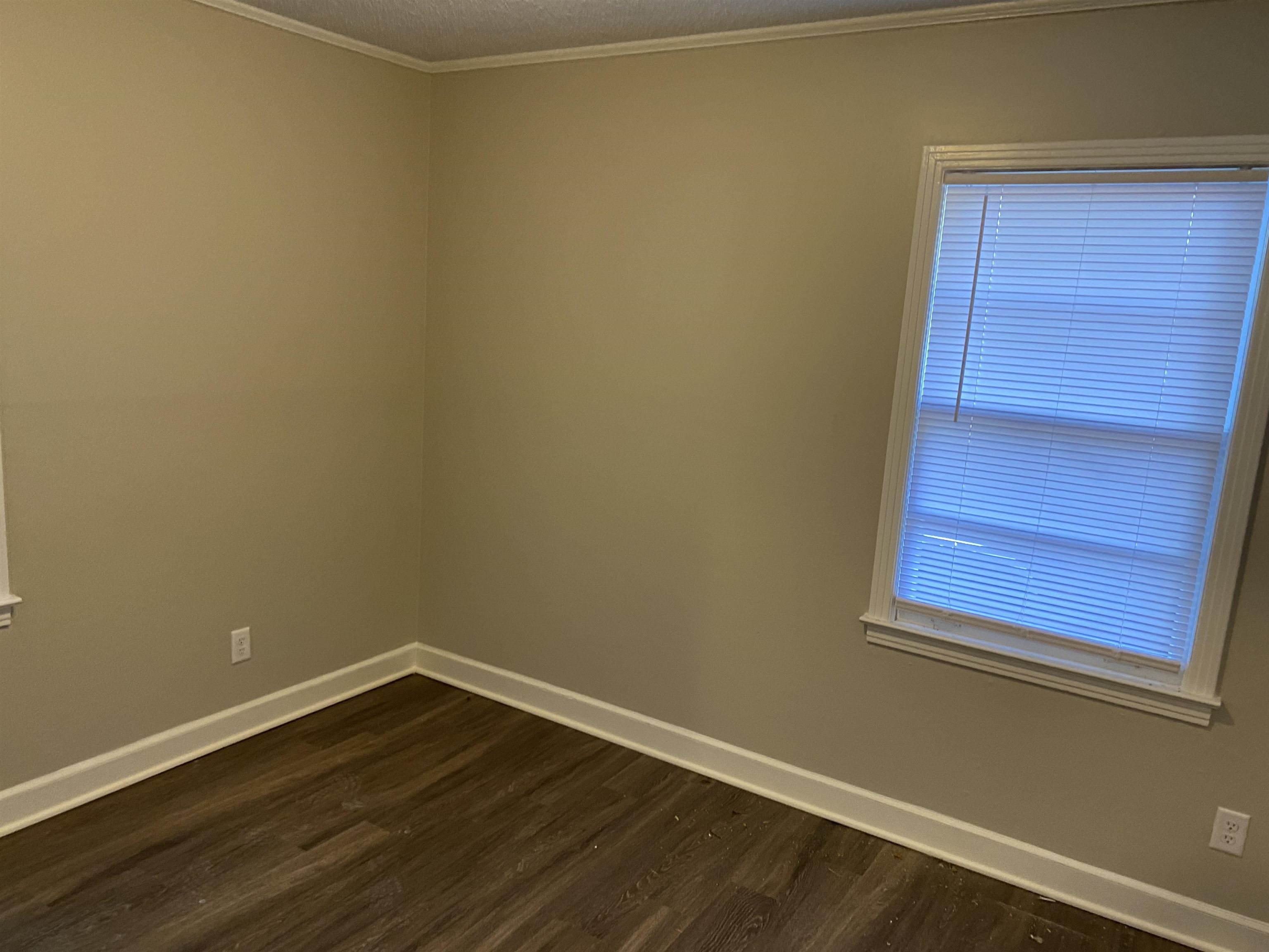 4679 Lynn Road Memphis, TN 38122 - Photo 7 of 8 a view of a small space with wooden floor and a window