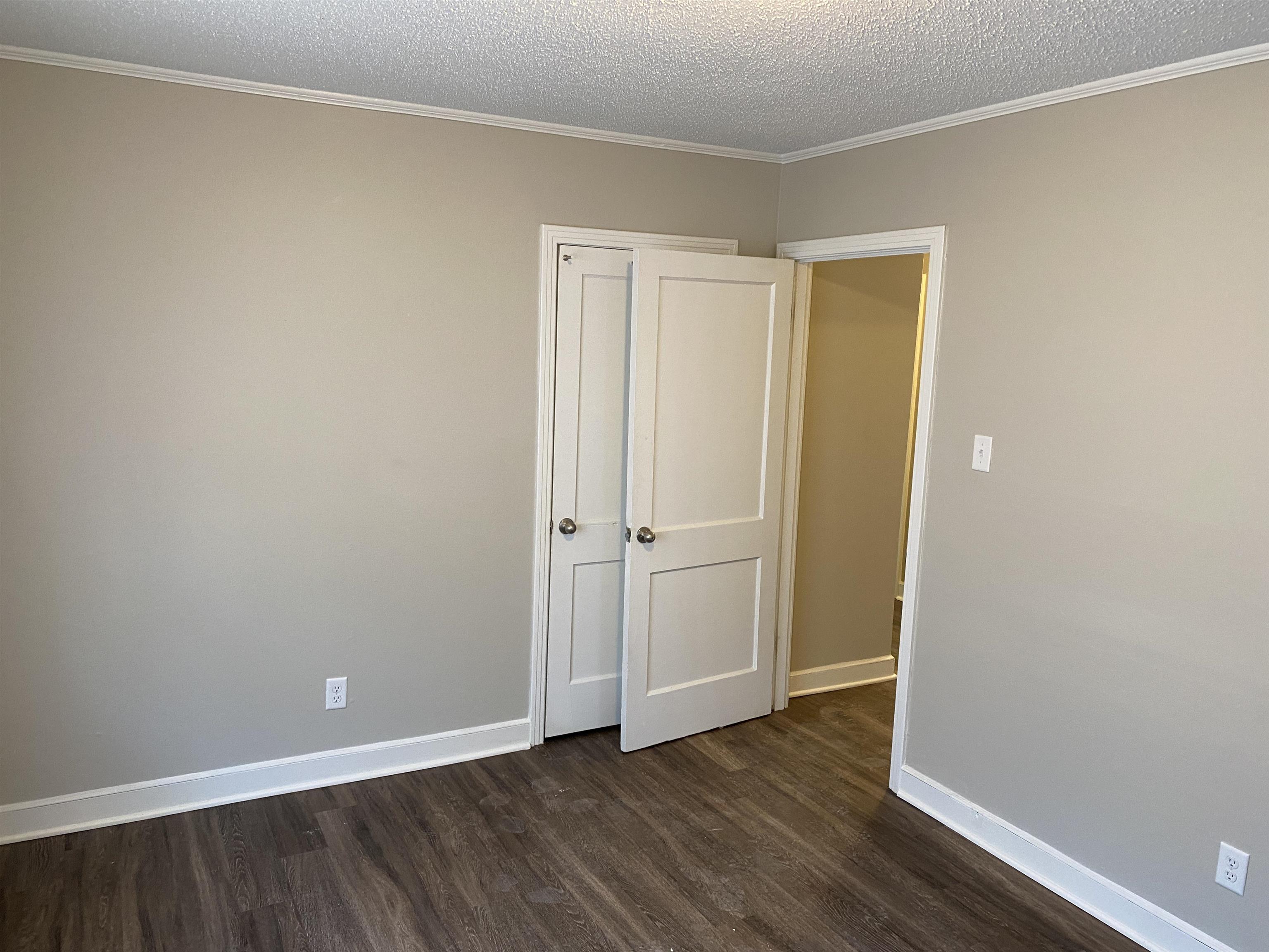 4679 Lynn Road Memphis, TN 38122 - Photo 8 of 8 a view of an empty room with wooden floor