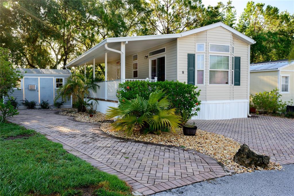 20285 Highway 27, Unit 8 Clermont, FL 34715 - Photo 12 of 16 a front view of a house with a yard
