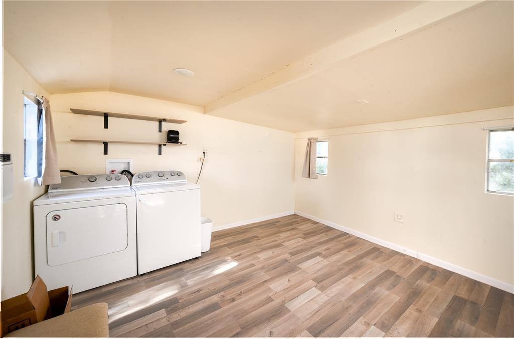 20285 Highway 27, Unit 8 Clermont, FL 34715 - Photo 10 of 16 a utility room with cabinets washer and dryer