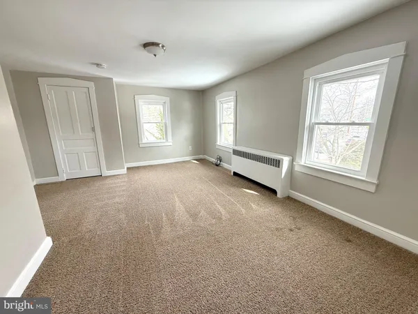 an empty room with windows