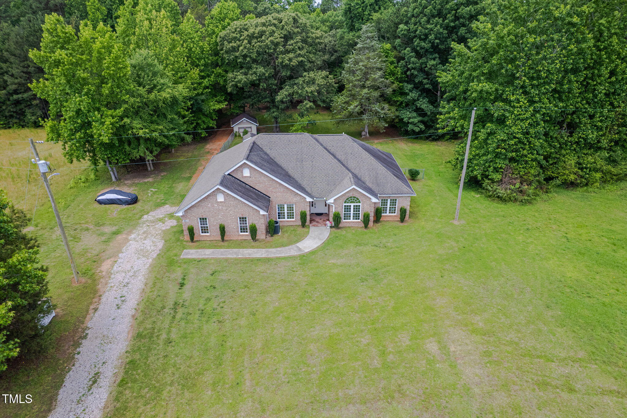 8917 Thompson Mill Road Wake Forest, NC 27587 - Photo 2 of 42 a aerial view of a house with swimming pool next to a big yard