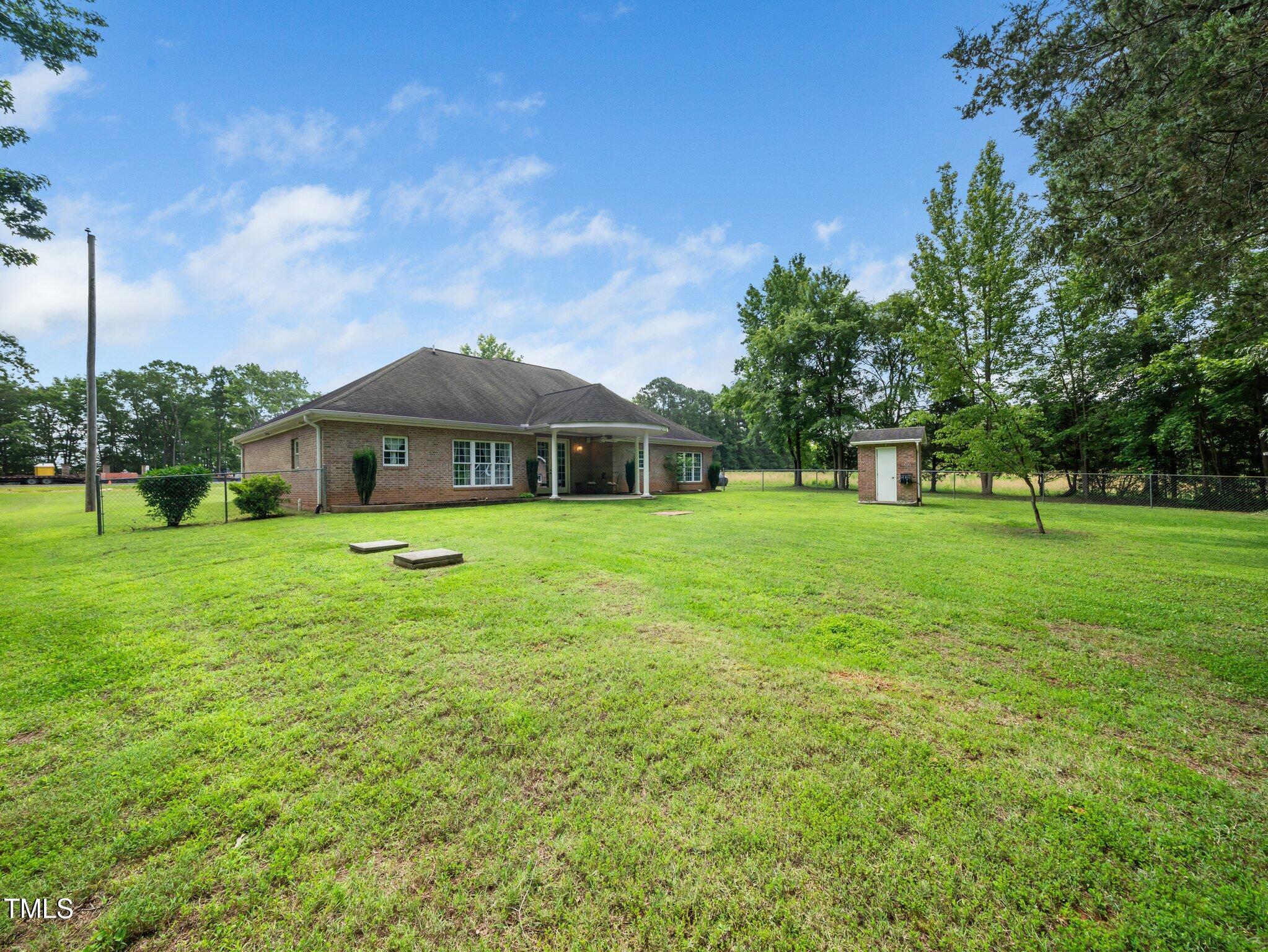 8917 Thompson Mill Road Wake Forest, NC 27587 - Photo 28 of 42 a front view of a house with garden