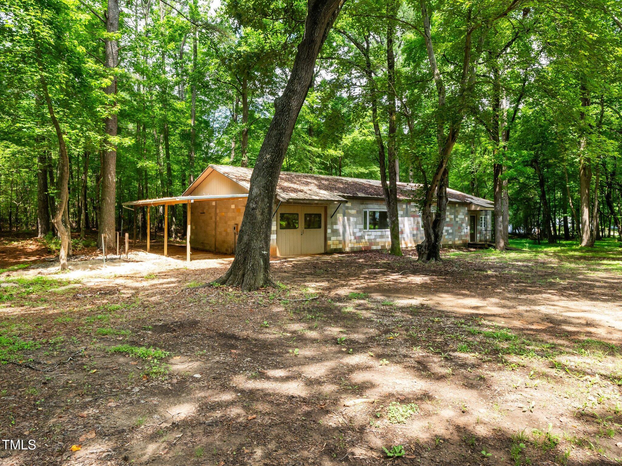 8917 Thompson Mill Road Wake Forest, NC 27587 - Photo 31 of 42 a backyard of a house with table and chairs
