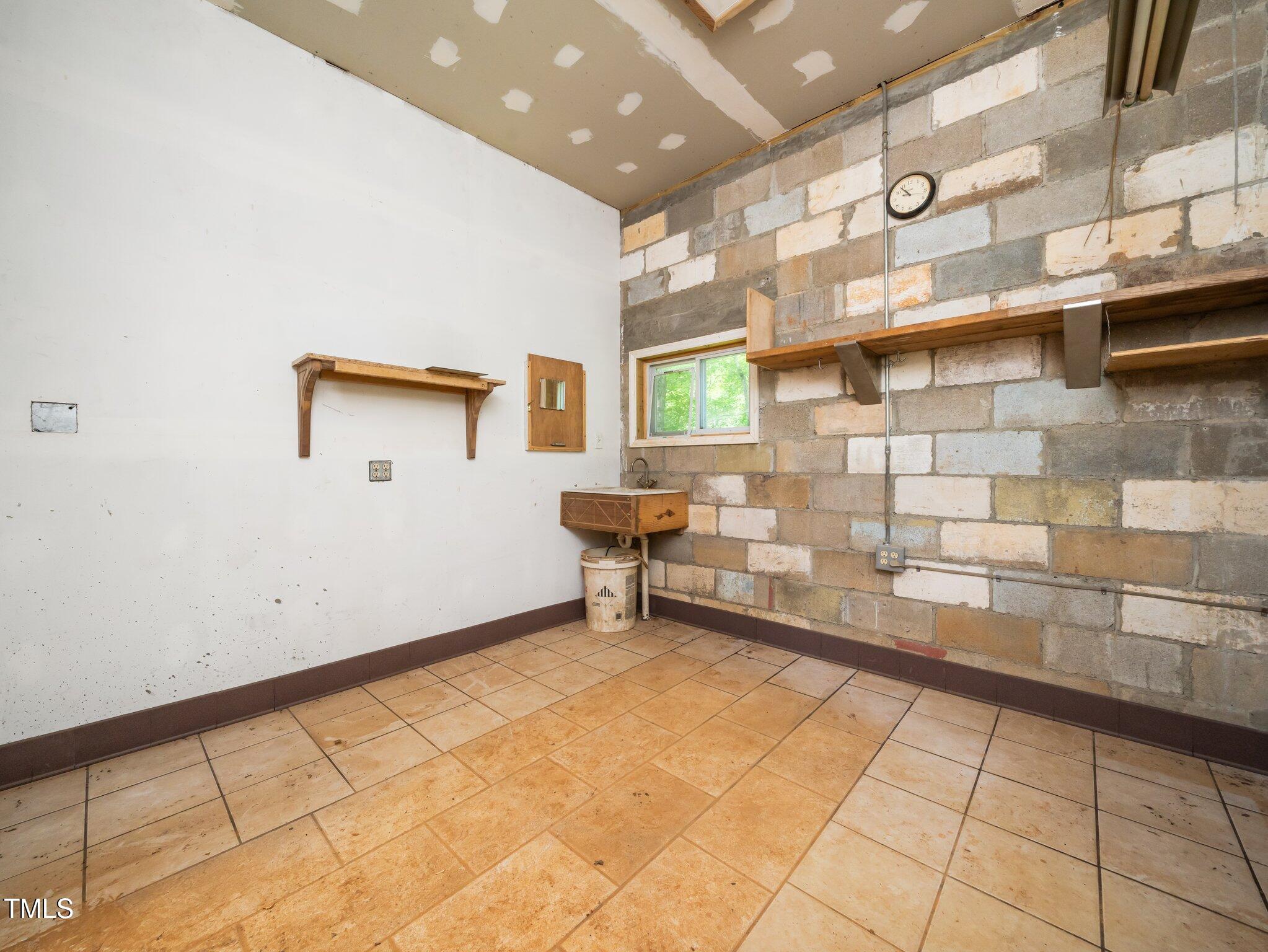 8917 Thompson Mill Road Wake Forest, NC 27587 - Photo 34 of 42 a view of an empty room with a sink
