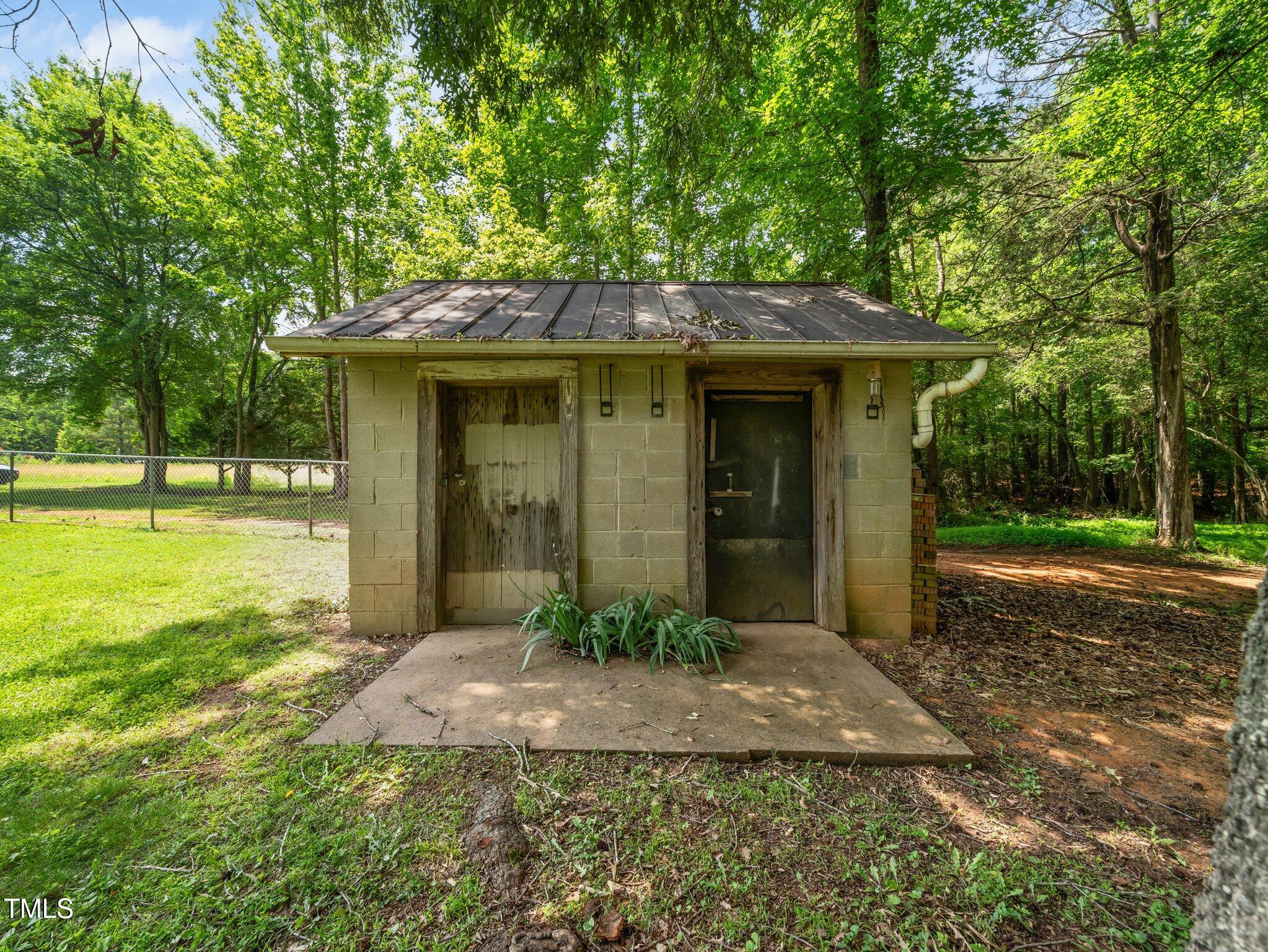 8917 Thompson Mill Road Wake Forest, NC 27587 - Photo 38 of 42 a front view of a house with garden