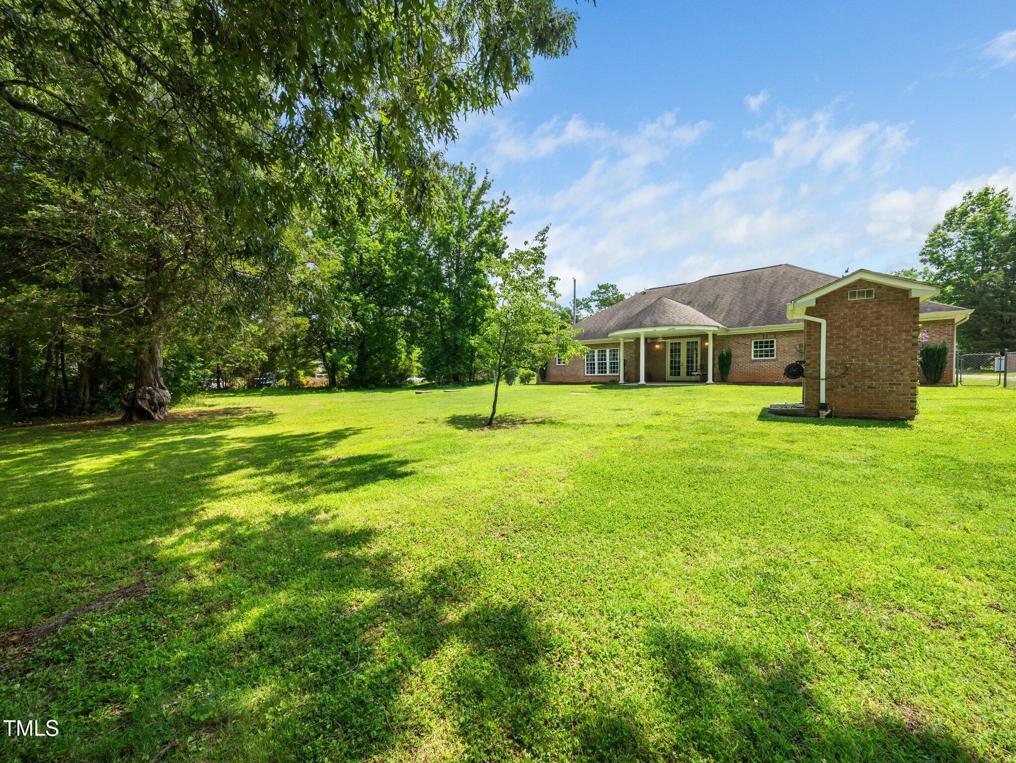 8917 Thompson Mill Road Wake Forest, NC 27587 - Photo 39 of 42 a view of a house with a big yard
