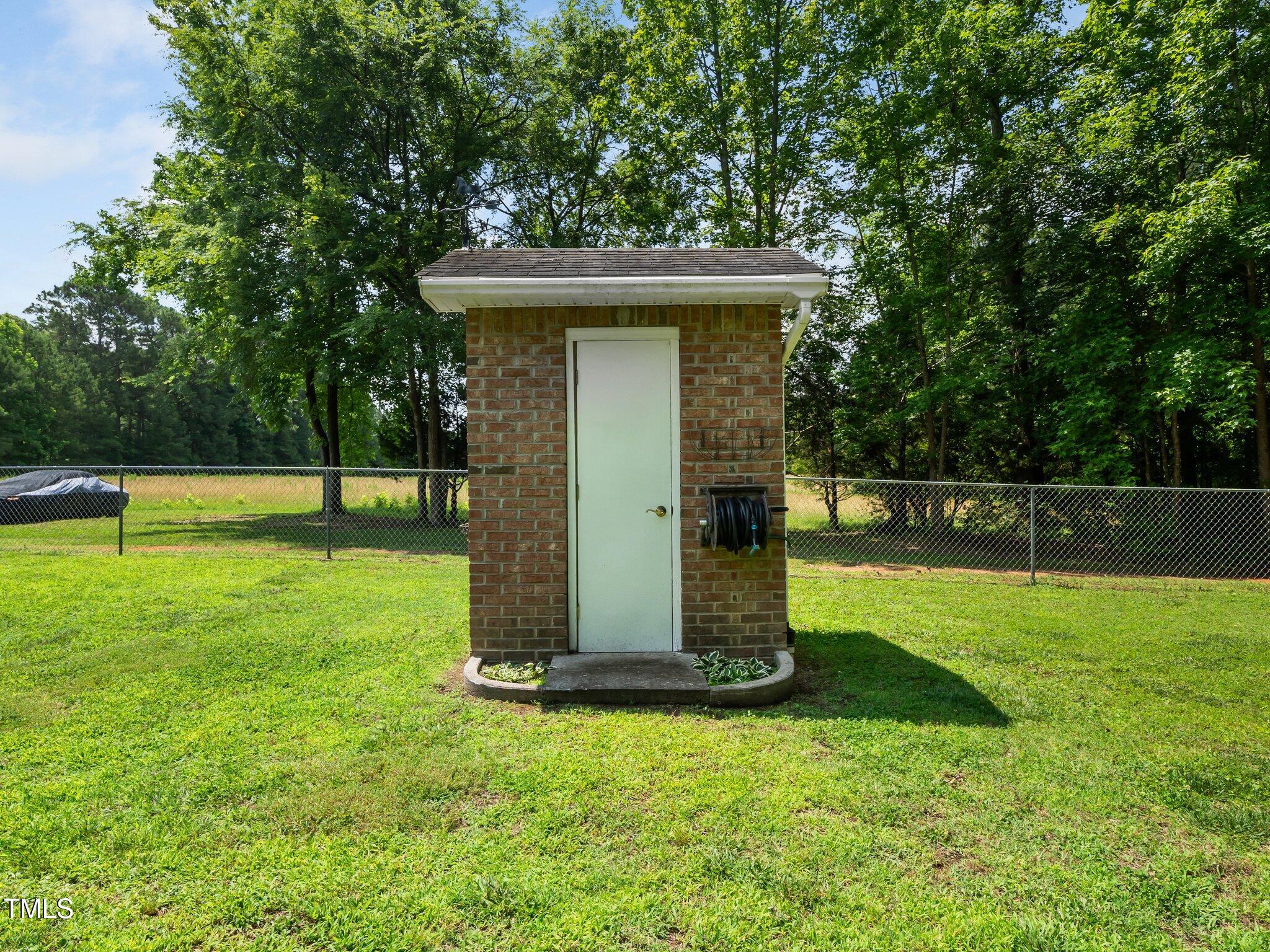 8917 Thompson Mill Road Wake Forest, NC 27587 - Photo 40 of 42 a view of a tiny house with a park