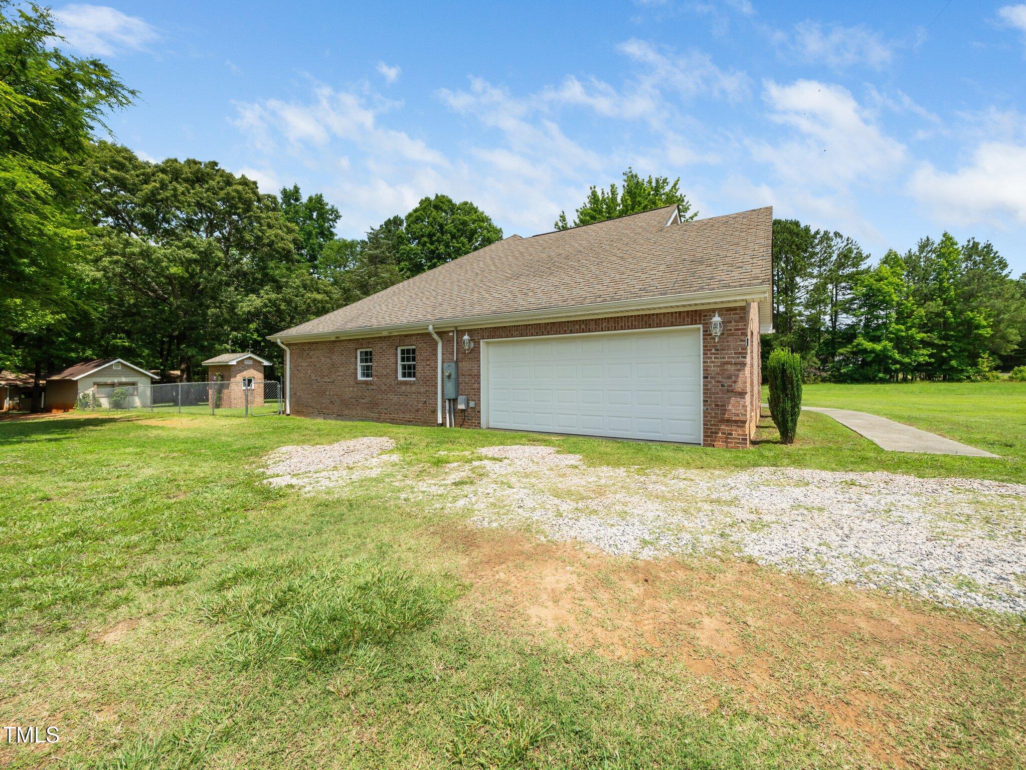 8917 Thompson Mill Road Wake Forest, NC 27587 - Photo 42 of 42 a house with garden in front of it