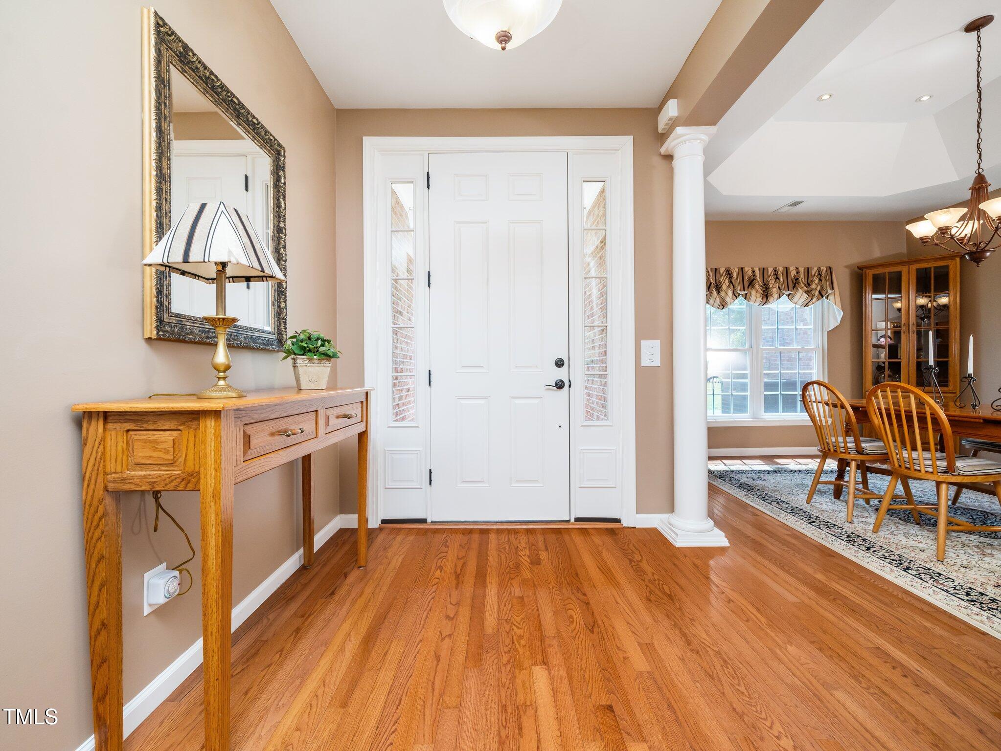 8917 Thompson Mill Road Wake Forest, NC 27587 - Photo 6 of 42 a very nice looking room with wooden floor