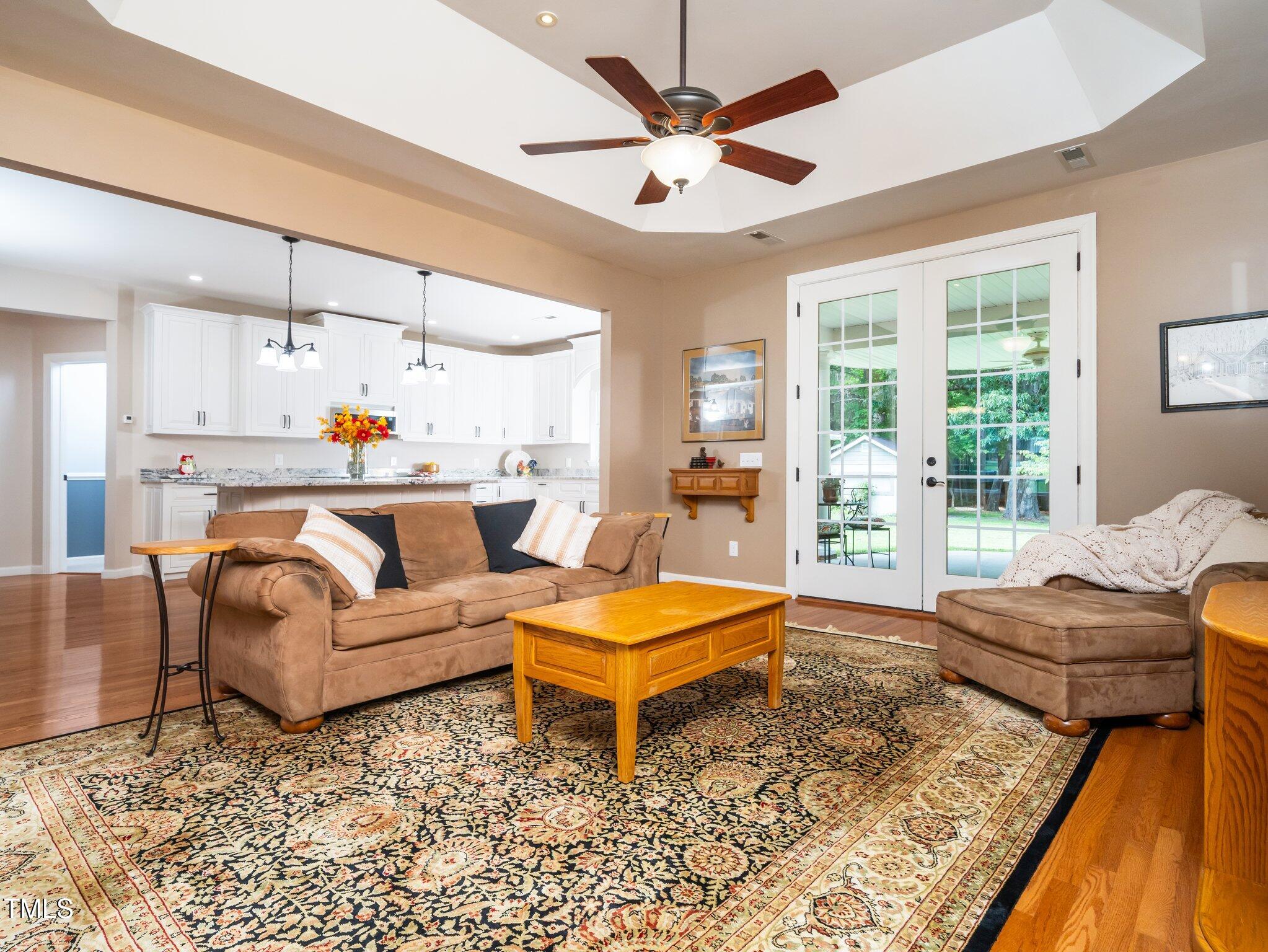 8917 Thompson Mill Road Wake Forest, NC 27587 - Photo 8 of 42 a living room with furniture and a large window