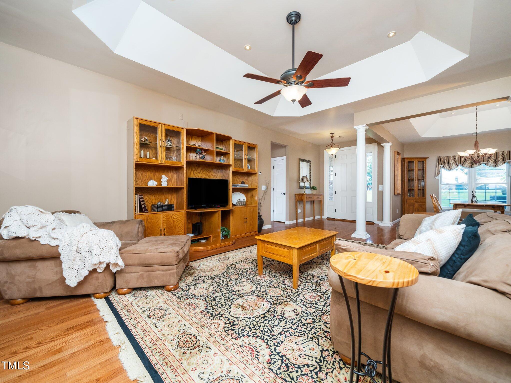 8917 Thompson Mill Road Wake Forest, NC 27587 - Photo 10 of 42 a living room with furniture a rug and white walls