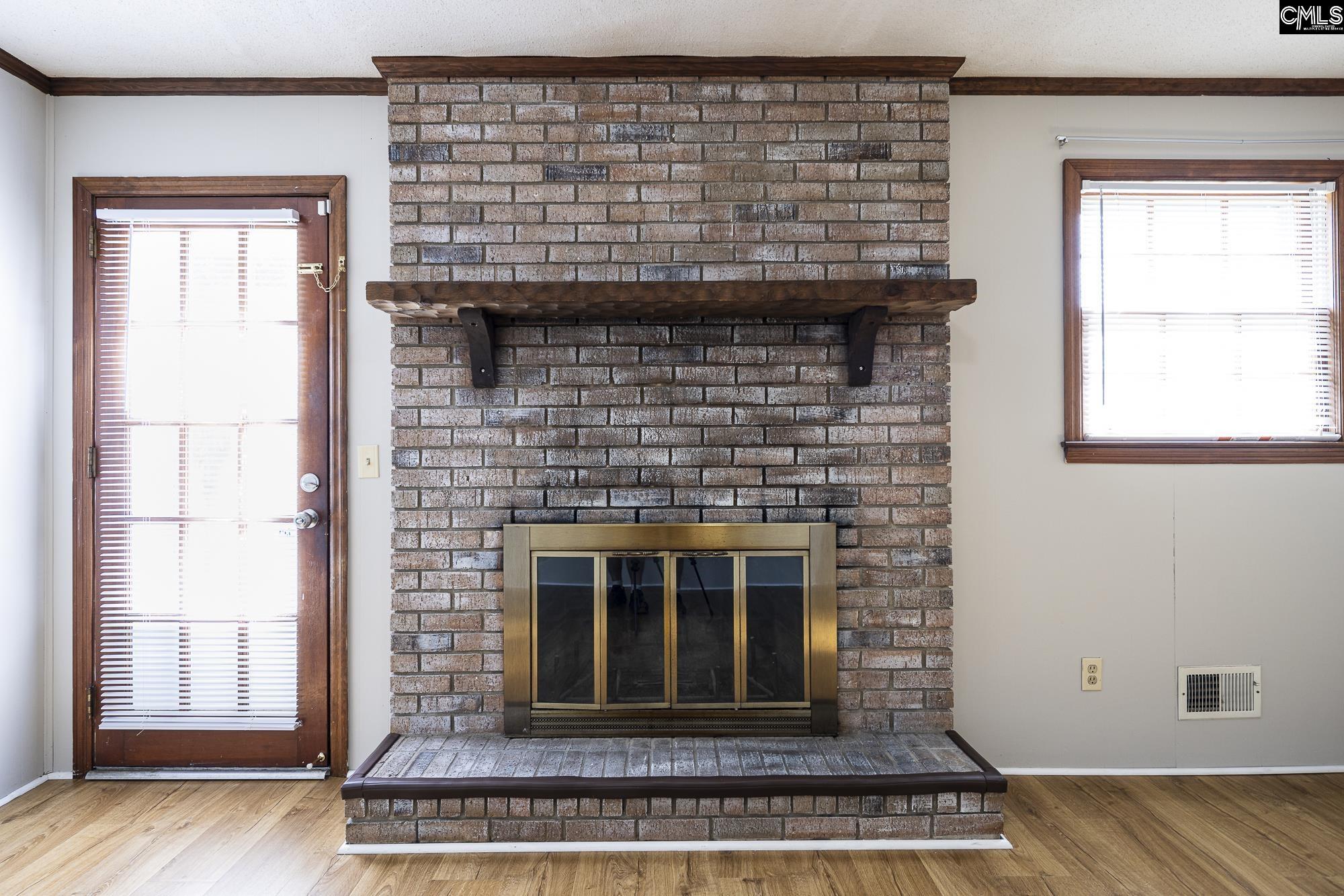 4083 Platt Springs Road West Columbia, SC 29170 - Photo 16 of 35 a living room with a fireplace