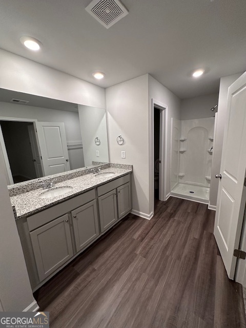 116 Deer Crossing Temple, GA 30179 - Photo 16 of 29 a spacious bathroom with a granite countertop sink and a mirror